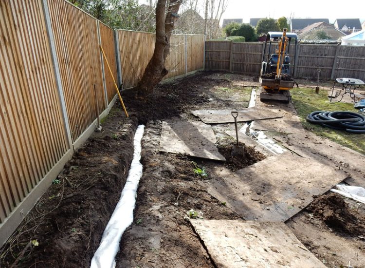 Garden and Lawn Drainage Liss, Hampshire, GU33 - A moderately sized rear garden backing onto and near a pond with its surround set higher than the rear garden. Garden and Lawn Drainage Liss, Hampshire, GU33 - A moderately sized rear garden backing onto and near a pond with its surround set higher than the rear garden.