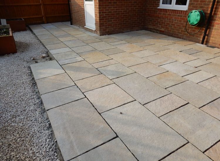 Garden Paving Bramley, Tadley, Hampshire, RG26 - Kota yellow limestone paving to form a terrace area and pathway. Garden Paving Bramley, Tadley, Hampshire, RG26 - Kota yellow limestone paving to form a terrace area and pathway.