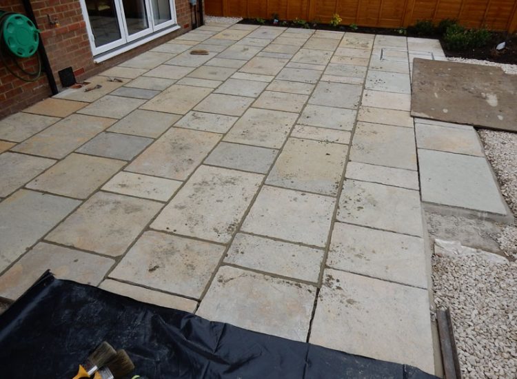 Garden Paving Bramley, Tadley, Hampshire, RG26 - Kota yellow limestone paving to form a terrace area and pathway. Garden Paving Bramley, Tadley, Hampshire, RG26 - Kota yellow limestone paving to form a terrace area and pathway.