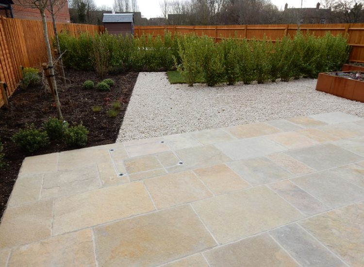 Garden Paving Bramley, Tadley, Hampshire, RG26 - Kota yellow limestone paving to form a terrace area and pathway.