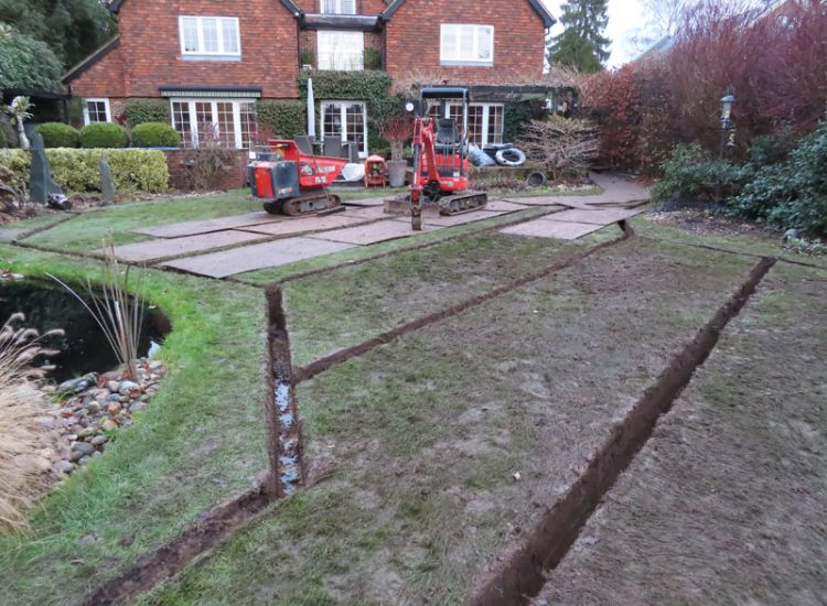 Lawn Drainage Cobham, Surrey, KT11 - With a clay based soil medium, this clients lawn was getting more and more difficult to manage and maintain, along with problems related to a small pond area. Lawn Drainage Cobham, Surrey, KT11 - With a clay based soil medium, this clients lawn was getting more and more difficult to manage and maintain, along with problems related to a small pond area.