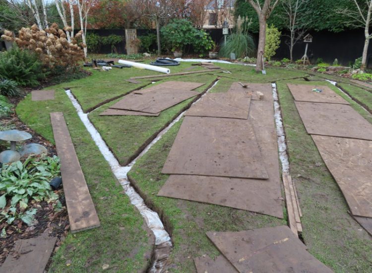 Lawn Drainage Cobham, Surrey, KT11 - With a clay based soil medium, this clients lawn was getting more and more difficult to manage and maintain, along with problems related to a small pond area. Lawn Drainage Cobham, Surrey, KT11 - With a clay based soil medium, this clients lawn was getting more and more difficult to manage and maintain, along with problems related to a small pond area.