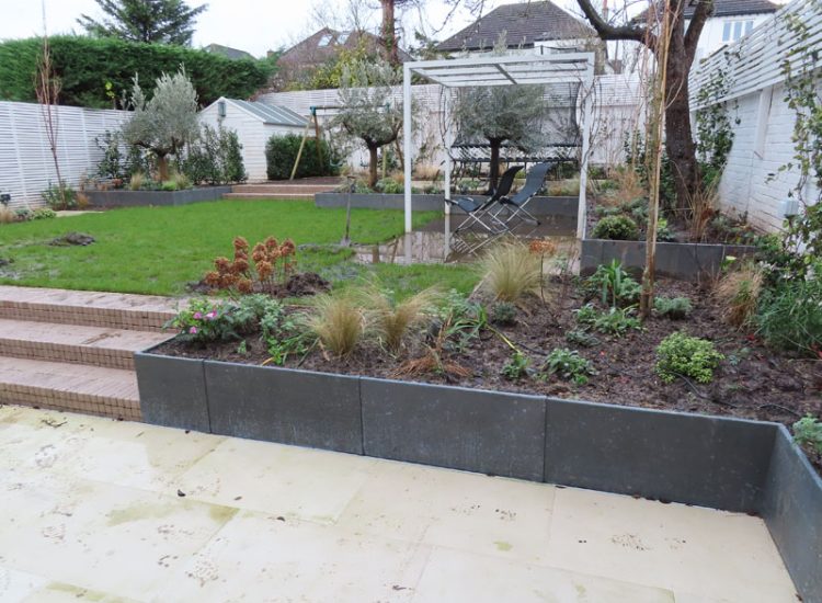 Lawn and Garden Drainage Raynes Park, London, SW20 - Failed drainage solutions needing to be resolved in a recently completed landscaped rear garden. Lawn and Garden Drainage Raynes Park, London, SW20 - Failed drainage solutions needing to be resolved in a recently completed landscaped rear garden.