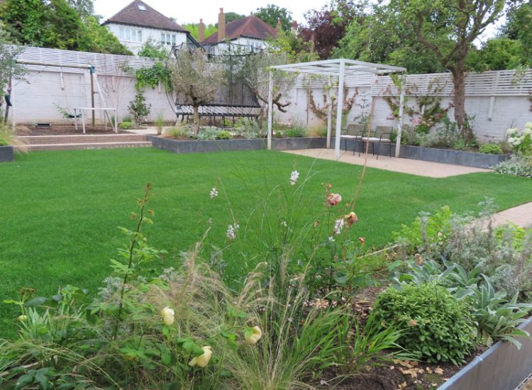 Lawn and Garden Drainage Raynes Park, London, SW20 - Failed drainage solutions needing to be resolved in a recently completed landscaped rear garden.