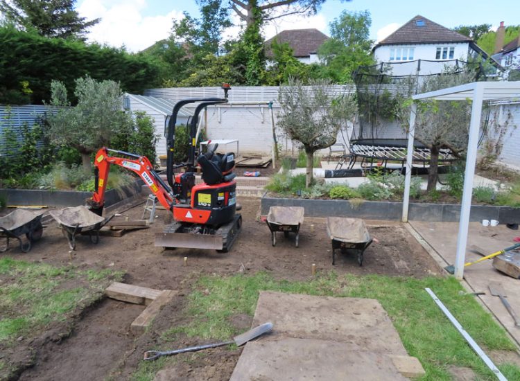 Lawn and Garden Drainage Raynes Park, London, SW20 - Failed drainage solutions needing to be resolved in a recently completed landscaped rear garden. Lawn and Garden Drainage Raynes Park, London, SW20 - Failed drainage solutions needing to be resolved in a recently completed landscaped rear garden.