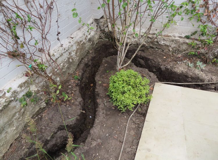 Lawn and Garden Drainage Raynes Park, London, SW20 - Failed drainage solutions needing to be resolved in a recently completed landscaped rear garden. Lawn and Garden Drainage Raynes Park, London, SW20 - Failed drainage solutions needing to be resolved in a recently completed landscaped rear garden.