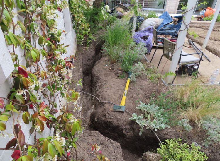 Lawn and Garden Drainage Raynes Park, London, SW20 - Failed drainage solutions needing to be resolved in a recently completed landscaped rear garden. Lawn and Garden Drainage Raynes Park, London, SW20 - Failed drainage solutions needing to be resolved in a recently completed landscaped rear garden.