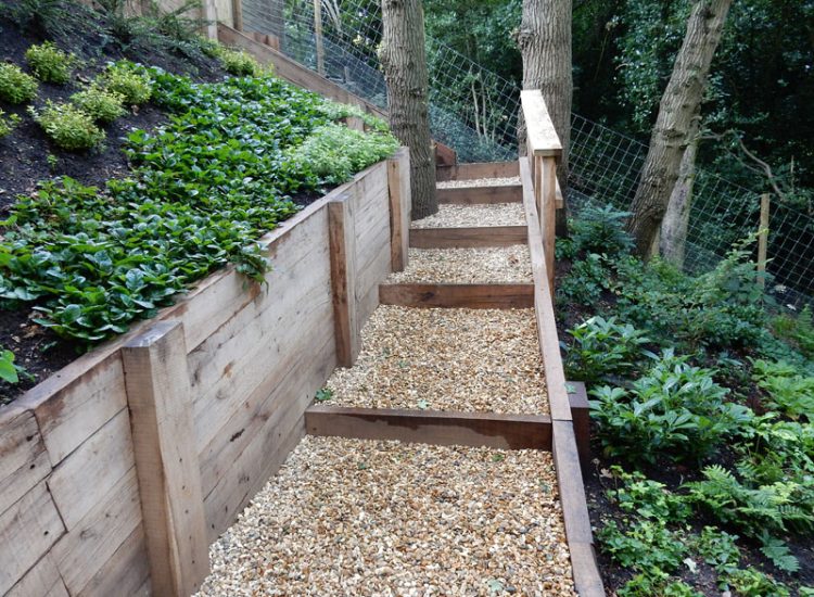 New Oak Sleeper Retaining Walls Farnham, Surrey, GU9 - Extensive oak sleeper retaining walls within an embankment area. New Oak Sleeper Retaining Walls Farnham, Surrey, GU9 - Extensive oak sleeper retaining walls within an embankment area.
