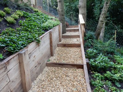 New Oak Sleeper Retaining Walls Farnham, Surrey, GU9 - Extensive oak sleeper retaining walls within an embankment area. New Oak Sleeper Retaining Walls Farnham, Surrey, GU9 - Extensive oak sleeper retaining walls within an embankment area.