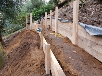 New Oak Sleeper Retaining Walls Farnham, Surrey, GU9 - Extensive oak sleeper retaining walls within an embankment area. New Oak Sleeper Retaining Walls Farnham, Surrey, GU9 - Extensive oak sleeper retaining walls within an embankment area.