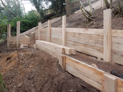 New Oak Sleeper Retaining Walls Farnham, Surrey, GU9 - Extensive oak sleeper retaining walls within an embankment area. New Oak Sleeper Retaining Walls Farnham, Surrey, GU9 - Extensive oak sleeper retaining walls within an embankment area.