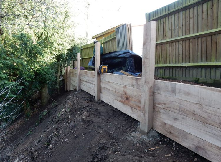 New Oak Sleeper Retaining Walls Farnham, Surrey, GU9 - Extensive oak sleeper retaining walls within an embankment area. New Oak Sleeper Retaining Walls Farnham, Surrey, GU9 - Extensive oak sleeper retaining walls within an embankment area.