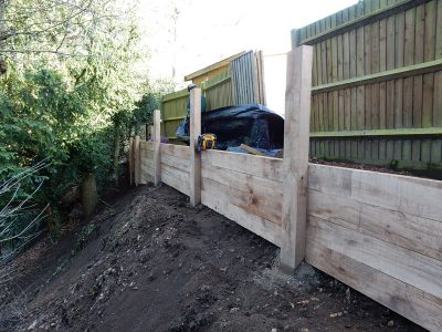New Oak Sleeper Retaining Walls Farnham, Surrey, GU9 - Extensive oak sleeper retaining walls within an embankment area. New Oak Sleeper Retaining Walls Farnham, Surrey, GU9 - Extensive oak sleeper retaining walls within an embankment area.