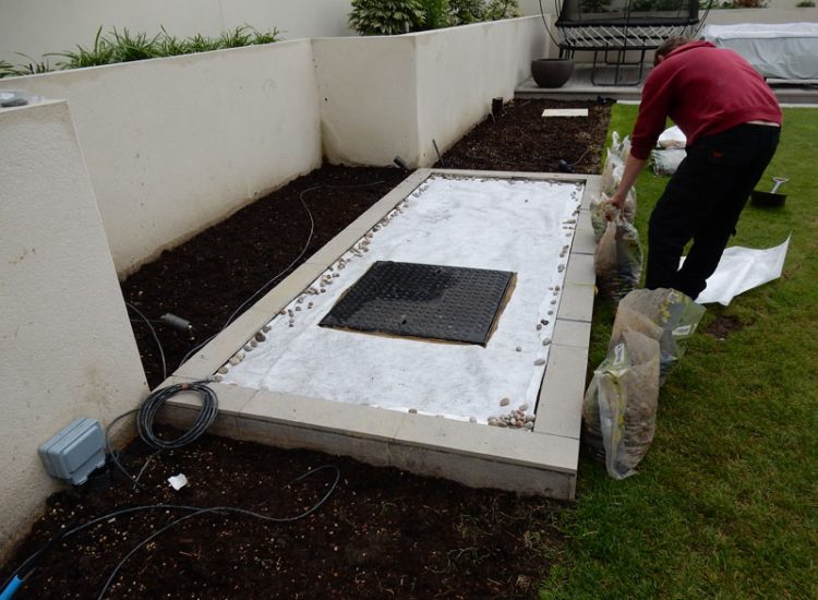 Garden and Planting Border Drainage Cobham, Surrey, KT11 - High retaining walls constructed with no drainage detail behind.