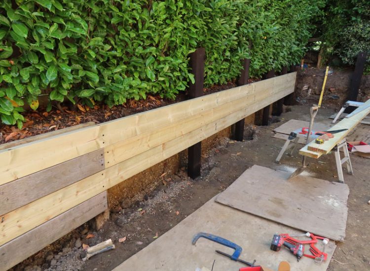 Timber Retaining Walling Claygate, Surrey, KT10 - Repair and replacement of sections of old, dilapidated timber walling. Timber Retaining Walling Claygate, Surrey, KT10 - Repair and replacement of sections of old, dilapidated timber walling.