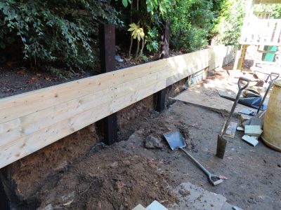 Timber Retaining Walling Claygate, Surrey, KT10 - Repair and replacement of sections of old, dilapidated timber walling. Timber Retaining Walling Claygate, Surrey, KT10 - Repair and replacement of sections of old, dilapidated timber walling.
