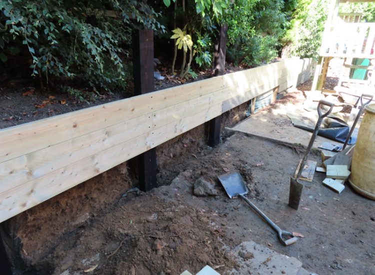 Timber Retaining Walling Claygate, Surrey, KT10 - Repair and replacement of sections of old, dilapidated timber walling. Timber Retaining Walling Claygate, Surrey, KT10 - Repair and replacement of sections of old, dilapidated timber walling.