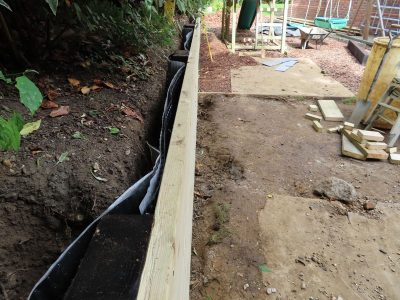 Timber Retaining Walling Claygate, Surrey, KT10 - Repair and replacement of sections of old, dilapidated timber walling. Timber Retaining Walling Claygate, Surrey, KT10 - Repair and replacement of sections of old, dilapidated timber walling.