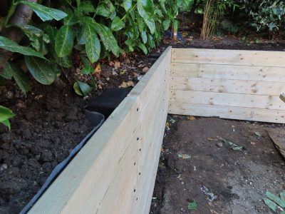 Timber Retaining Walling Claygate, Surrey, KT10 - Repair and replacement of sections of old, dilapidated timber walling. Timber Retaining Walling Claygate, Surrey, KT10 - Repair and replacement of sections of old, dilapidated timber walling.