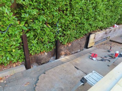 Timber Retaining Walling Claygate, Surrey, KT10 - Repair and replacement of sections of old, dilapidated timber walling. Timber Retaining Walling Claygate, Surrey, KT10 - Repair and replacement of sections of old, dilapidated timber walling.