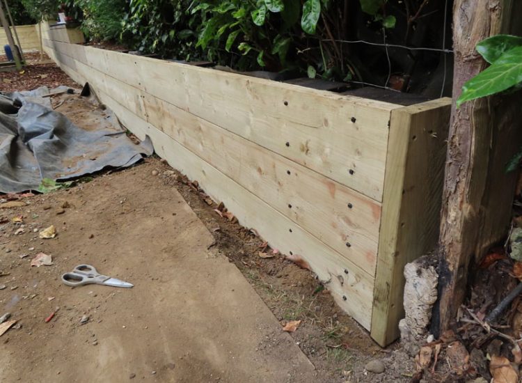 Timber Retaining Walling Claygate, Surrey, KT10 - Repair and replacement of sections of old, dilapidated timber walling. Timber Retaining Walling Claygate, Surrey, KT10 - Repair and replacement of sections of old, dilapidated timber walling.