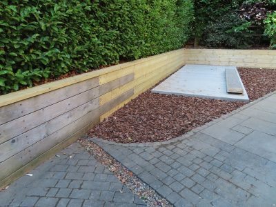 Timber Retaining Walling Claygate, Surrey, KT10 - Repair and replacement of sections of old, dilapidated timber walling. Timber Retaining Walling Claygate, Surrey, KT10 - Repair and replacement of sections of old, dilapidated timber walling.