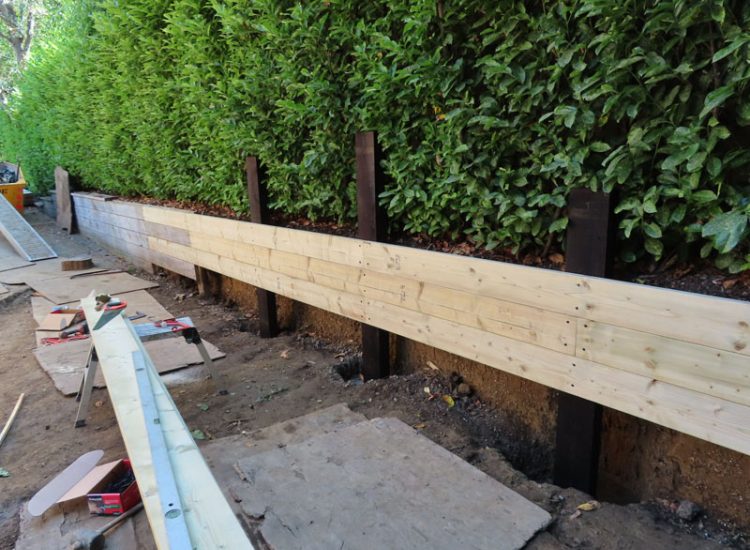 Timber Retaining Walling Claygate, Surrey, KT10 - Repair and replacement of sections of old, dilapidated timber walling. Timber Retaining Walling Claygate, Surrey, KT10 - Repair and replacement of sections of old, dilapidated timber walling.