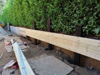 Timber Retaining Walling Claygate, Surrey, KT10 - Repair and replacement of sections of old, dilapidated timber walling. Timber Retaining Walling Claygate, Surrey, KT10 - Repair and replacement of sections of old, dilapidated timber walling.